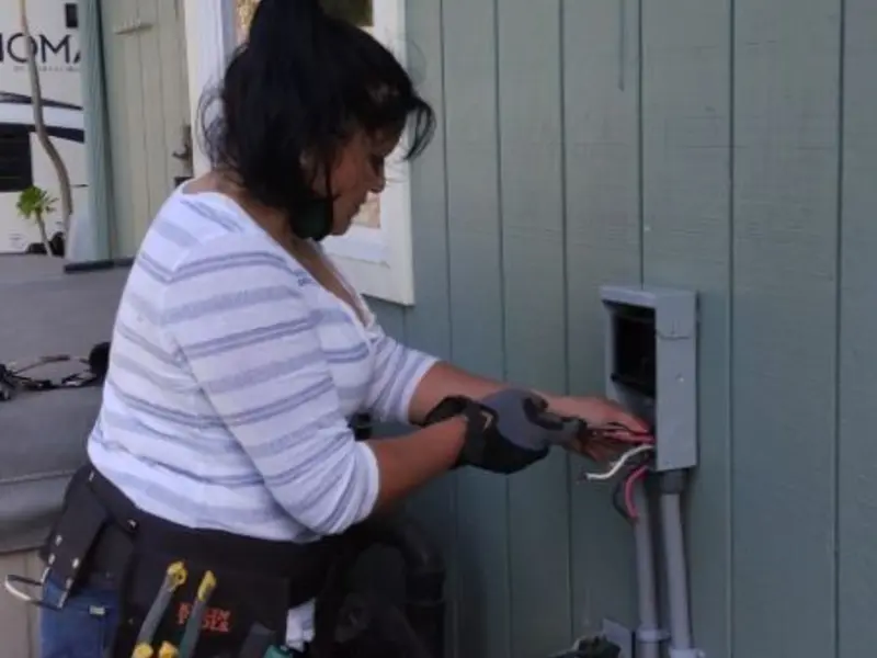 Licensed electrician wiring an exterior subpanel in Boulevard Park