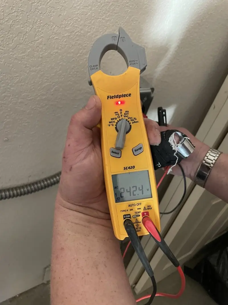 Voltage testing with clamp meter during Recessed Lighting Installation in Boulevard Park